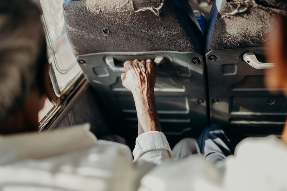 Close-up of passengers on a bus, highlighting the essence of road travel in India.