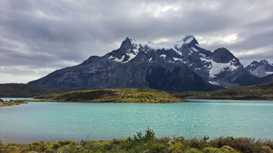 Stunning view of the Andes mountains with turquoise waters in Torres del Paine National Park, Chile.