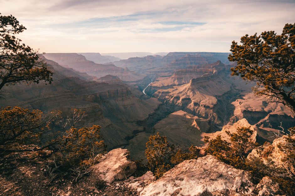 Stunning sunset over the Grand Canyon showcasing rocky formations and vibrant sky.